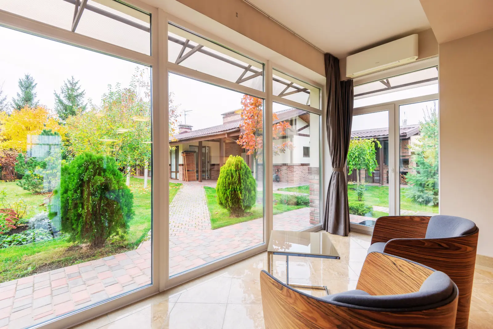 Waterfront South Florida living room with hurricane impact French and patio doors